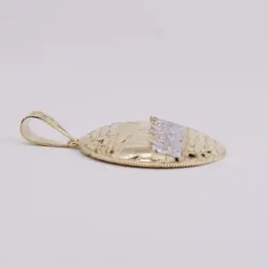 Gold pendant with intricate textured design.