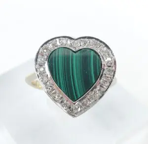 Heart-shaped malachite ring with diamond accents.