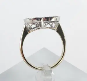 Gold ring with intricate silver setting.