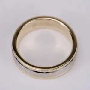 Gold and silver wedding band on display.