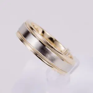 Gold and silver wedding band ring.