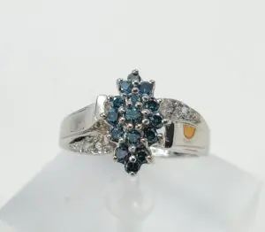 Silver ring with blue gemstone cluster.