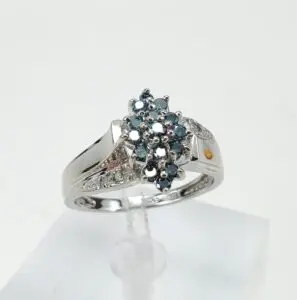 Silver ring with blue gemstone cluster.