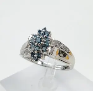 Silver ring with blue gemstone cluster.