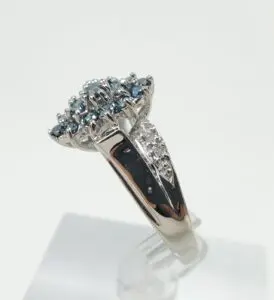 Silver ring with blue gemstone cluster.