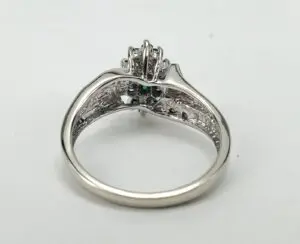 Silver ring with a decorative setting.