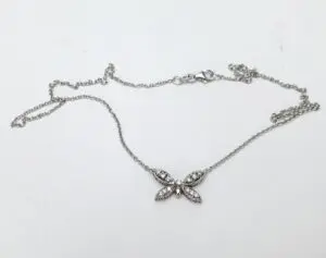 Butterfly pendant necklace with delicate chain.