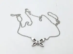 Butterfly pendant necklace on silver chain.