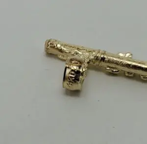 Golden key on a plain surface.