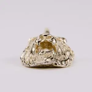 Gold lion head ring on display.