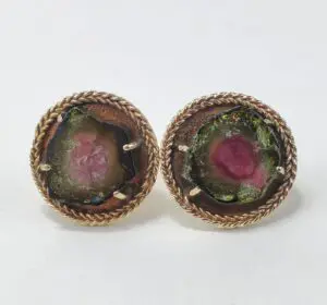 Two round watermelon tourmaline earrings.