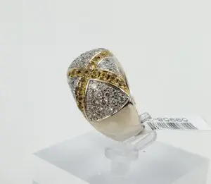 Gold and silver ring with diamonds displayed.