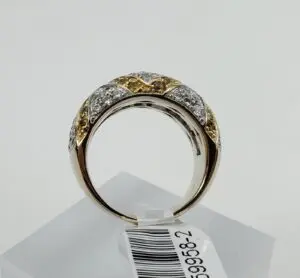 Gold and silver diamond ring on display.