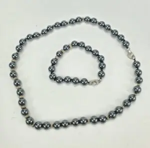Necklace and bracelet with dark beads.