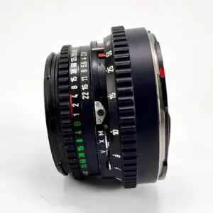 Vintage camera lens with focus and aperture rings.