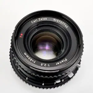 Camera lens with Carl Zeiss branding.