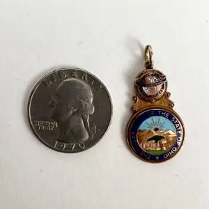 Quarter coin and Ohio state pendant.