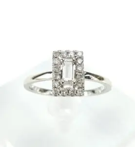 Silver ring with rectangular diamond cluster.
