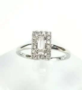 Diamond ring with rectangular center stone.