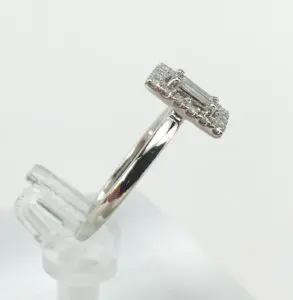 Silver ring with rectangular diamond setting.