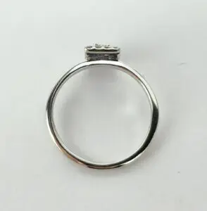Silver ring with a small rectangular setting.