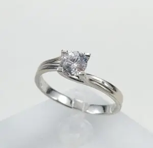 Silver ring with a single diamond.