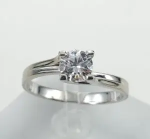 Silver engagement ring with a diamond gemstone.