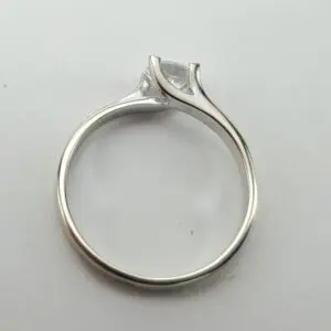 Silver ring with a marquise-cut diamond.