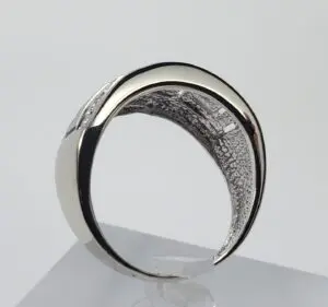 Silver ring with intricate interior design.