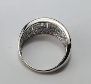 Silver ring with intricate interior design.