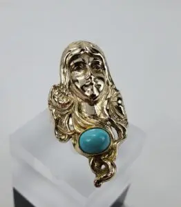 Gold ring with turquoise stone.