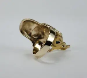 Gold ring with intricate design details.