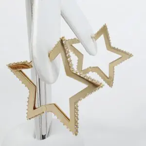 Gold star-shaped earrings with diamond accents.