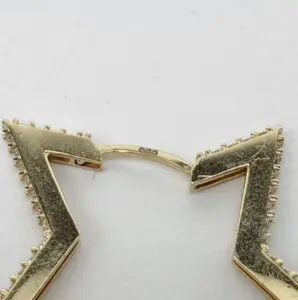 Gold jewelry clasp with "585" engraving.
