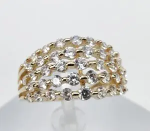 Gold ring with multiple diamond rows.