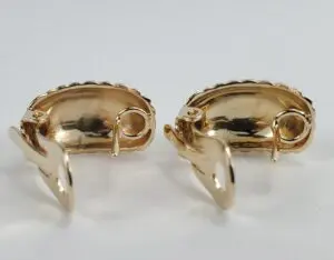 Gold clip-on earrings with curved design.