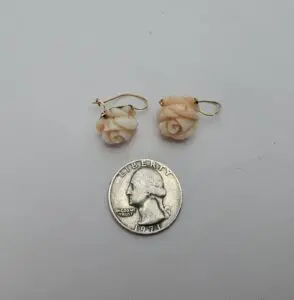 Rose earrings with a 1971 quarter.