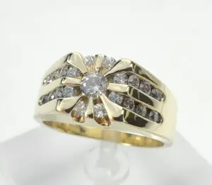 Gold ring with diamond accents displayed upright.