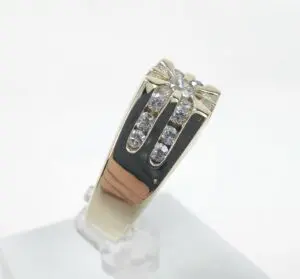 Diamond-studded silver ring on display stand.