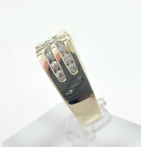 Gold ring with diamond accents on display.