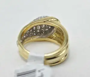 Gold ring with embedded diamonds, white background.