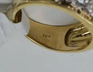 Gold ring with "18K" hallmark marking.