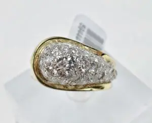Gold ring with diamond cluster design.