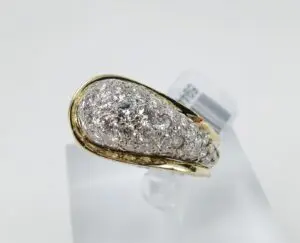 Gold ring with embedded sparkling diamonds.