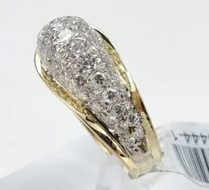 Gold ring with embedded diamonds, elegant design.