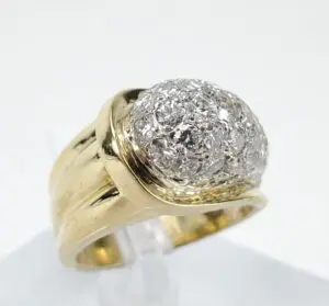 Gold ring with diamond cluster setting.
