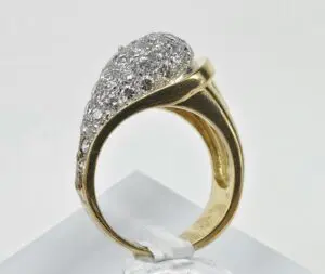 Gold ring with multiple sparkling diamonds.
