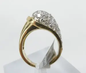 Gold ring with diamond cluster design.