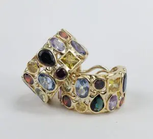 Gold earrings with colorful gemstones.