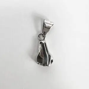 Silver pendant shaped like a nose.